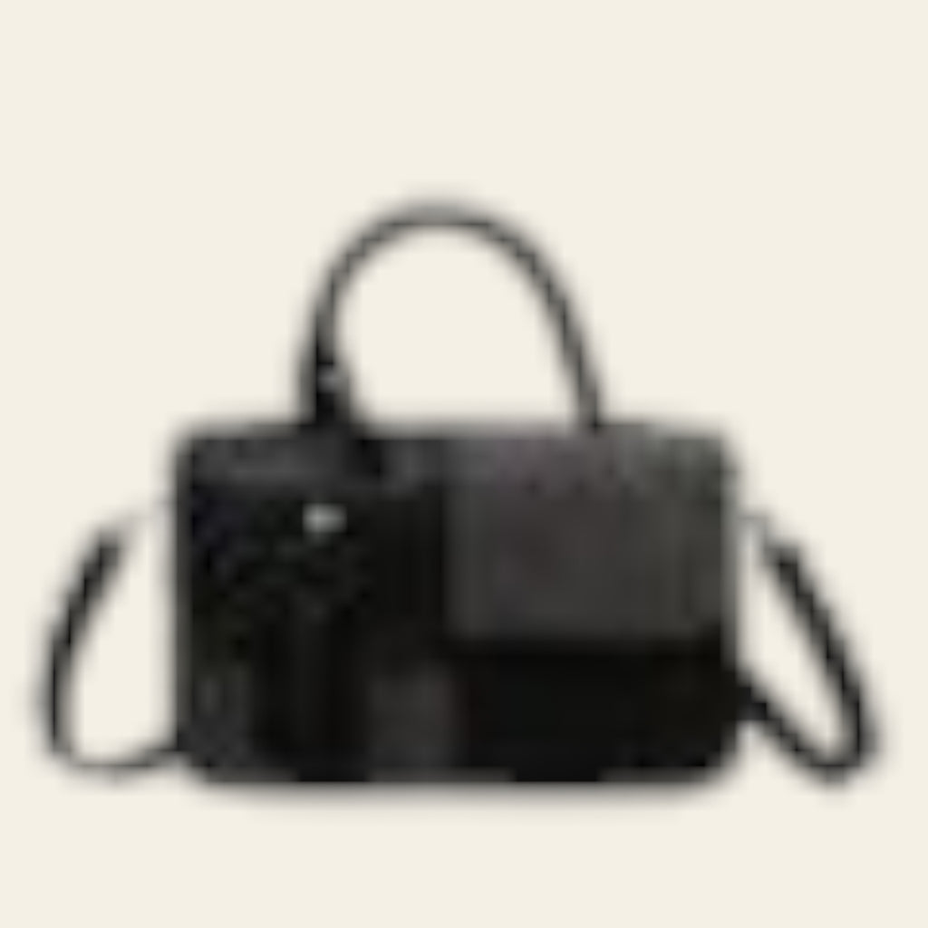 Black and gray handbag with gold accents on a white background