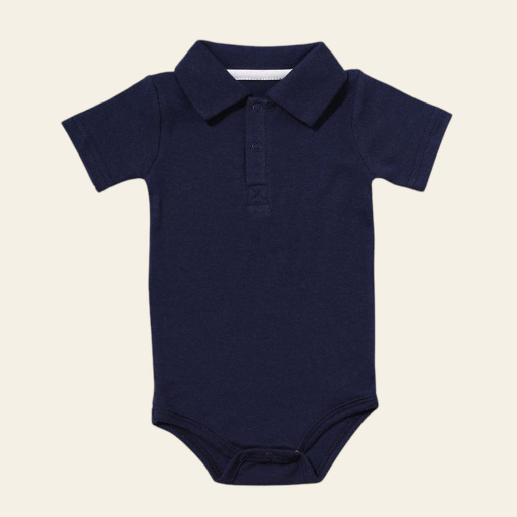 Navy blue baby onesie with a collar on a white background