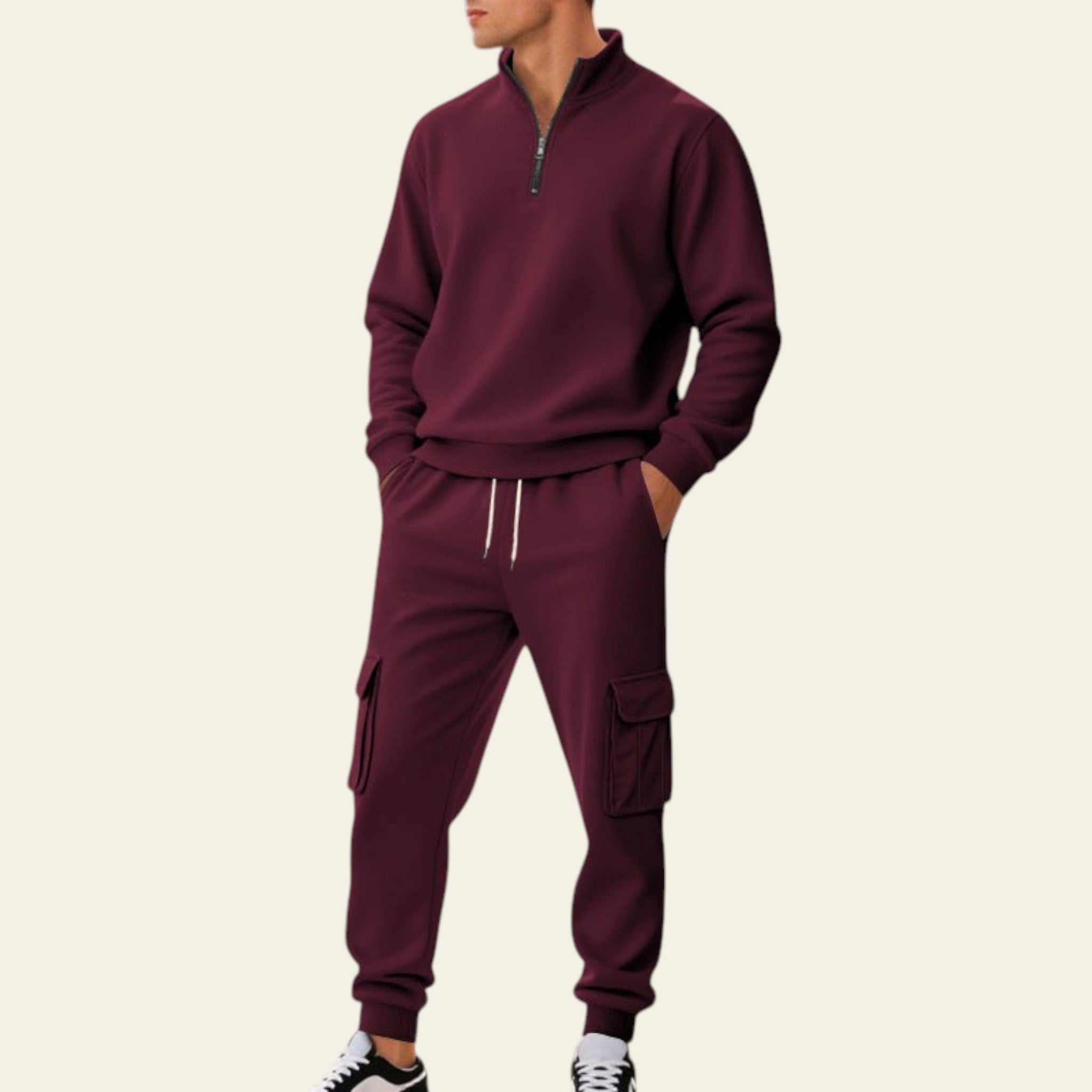 Man wearing a maroon fleece-lined tracksuit set with zip-up jacket and jogger pants on a city