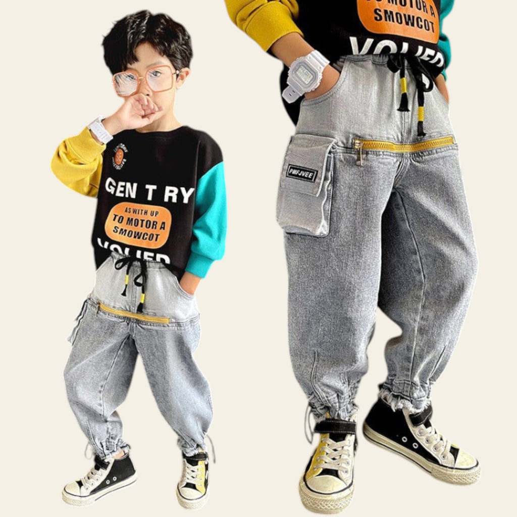 Two children wearing matching outfits with gray pants and colorful shirts.