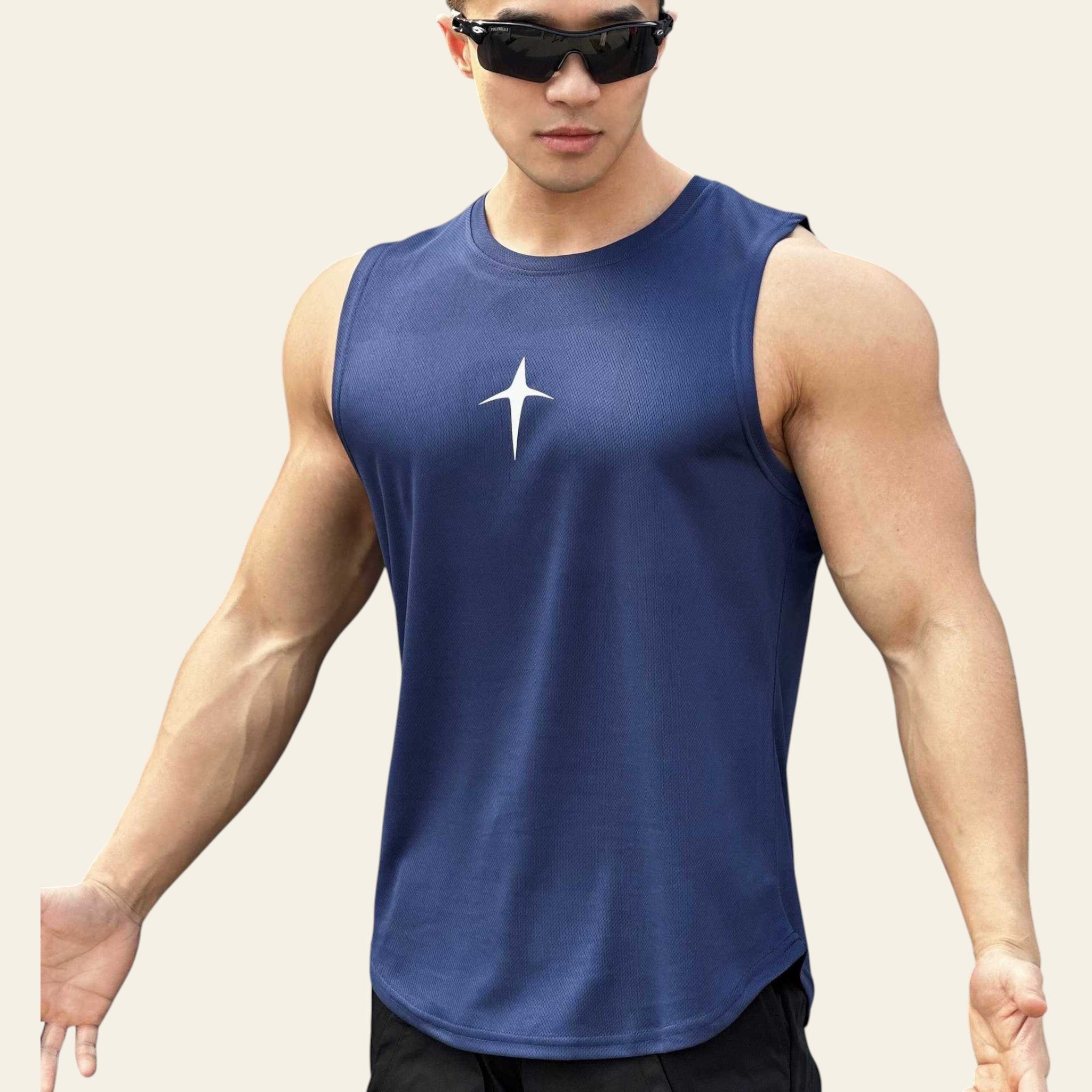 Man wearing a navy blue sleeveless crew neck slim-fit tank top