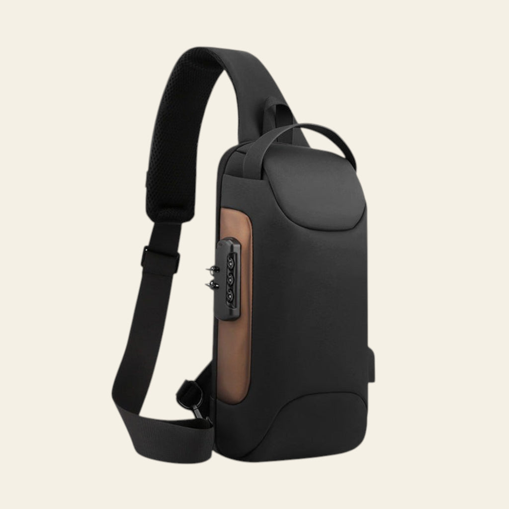 Black sling bag with a brown accent on a white background