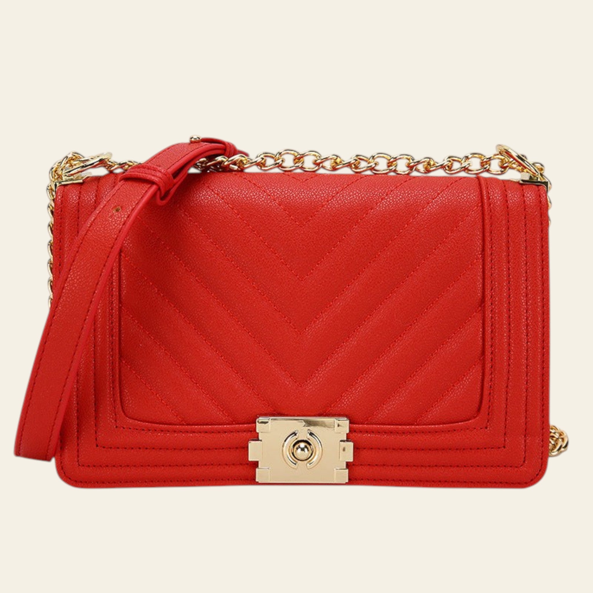 Red handbag with gold chain and lock on a white background