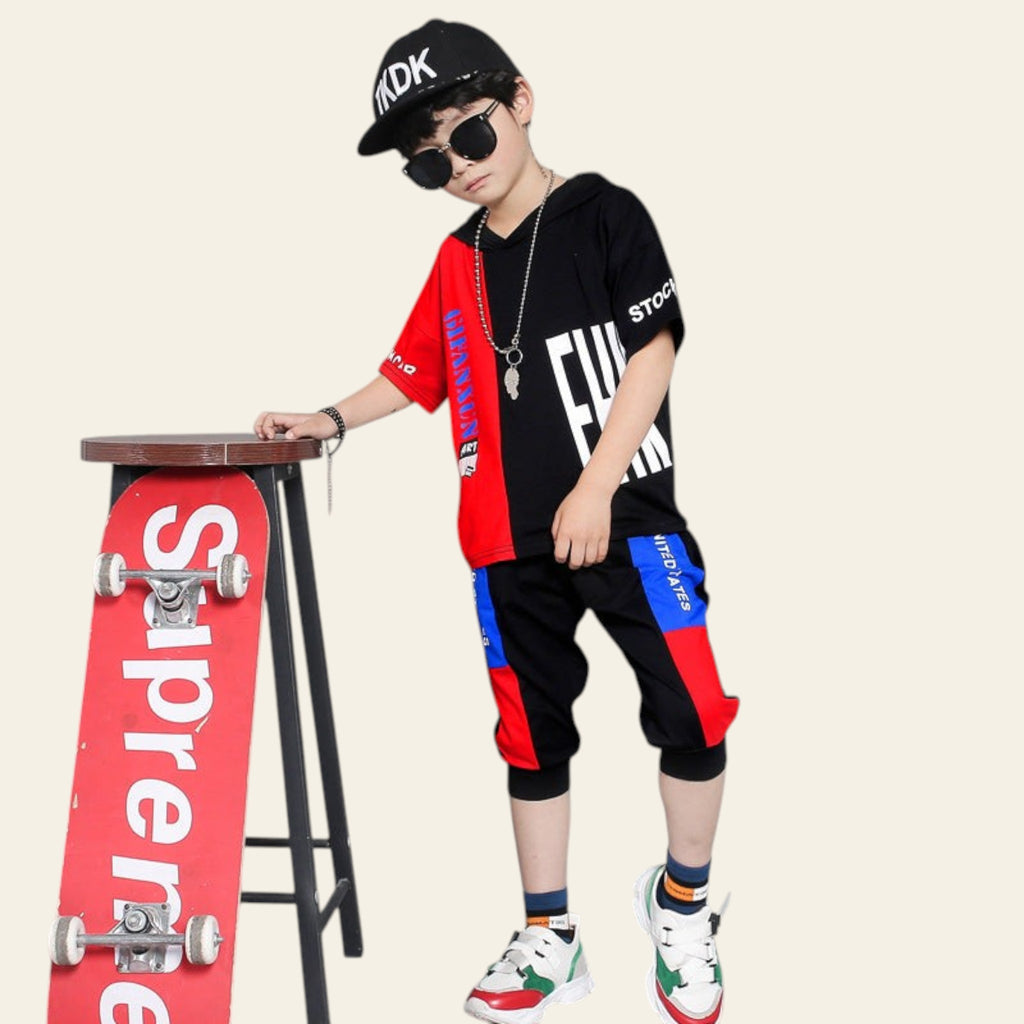 Person wearing a black cap and sunglasses, standing next to a red 'Supreme' skateboard on a gray background.