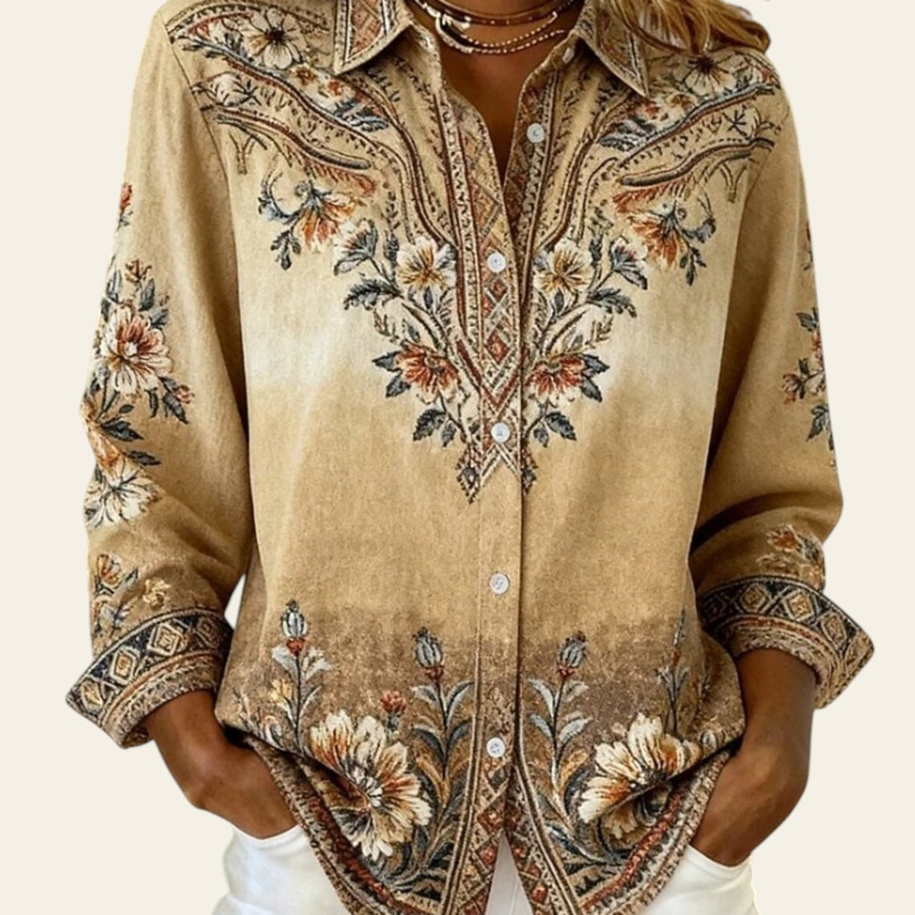 Beige embroidered shirt worn by a person with a neutral background