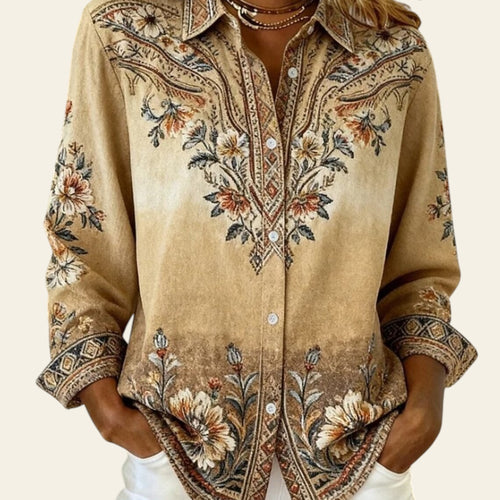 Beige embroidered shirt worn by a person with a neutral background