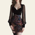 Woman wearing a black mini dress with sheer sleeves and paisley skirt