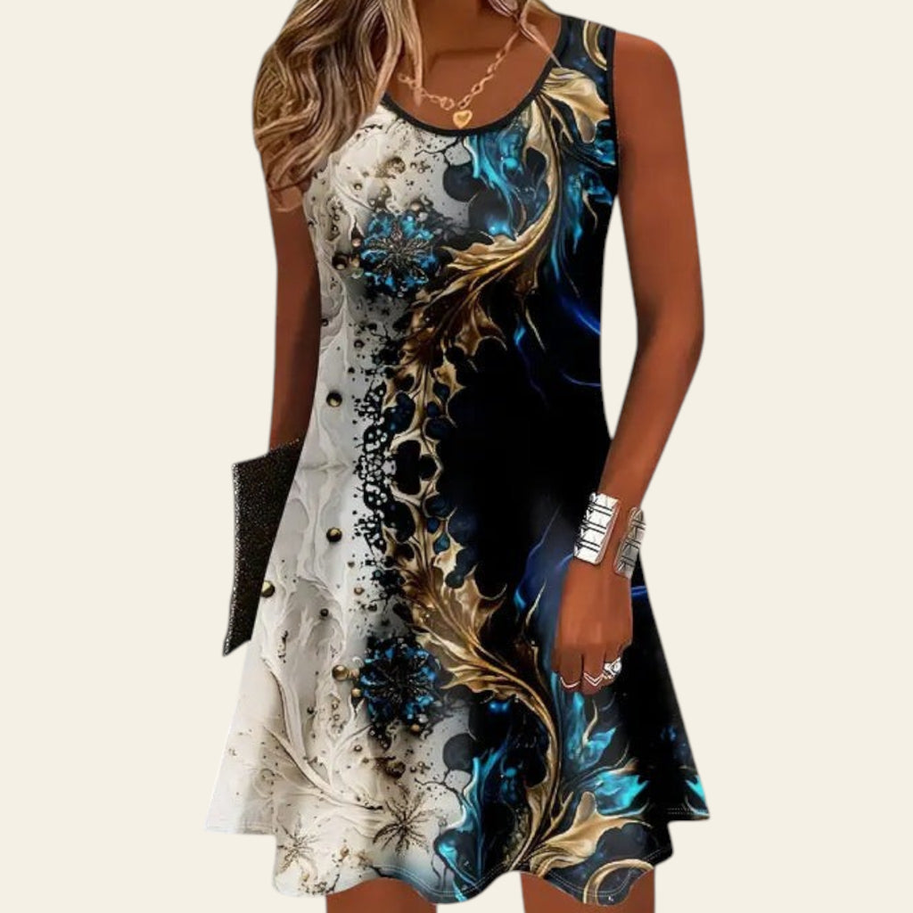 woman wearing a sleeveless dress with black and deep blue abstract floral patterns, accented with white and gold details