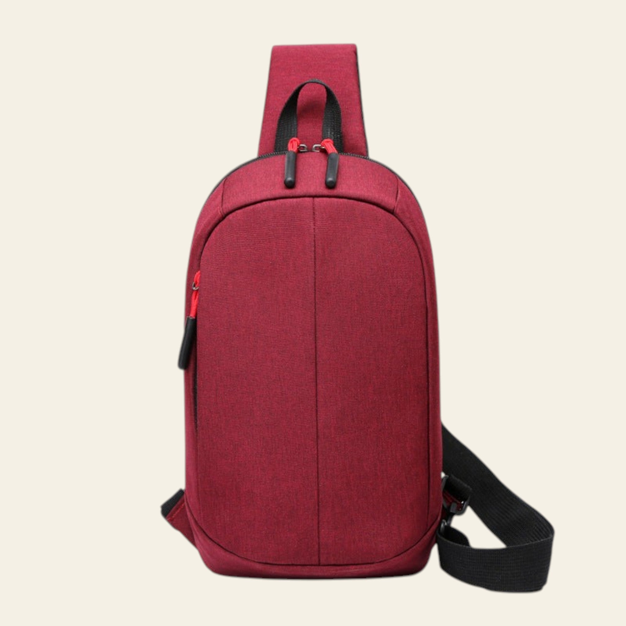 Red sling bag with black straps on a white background