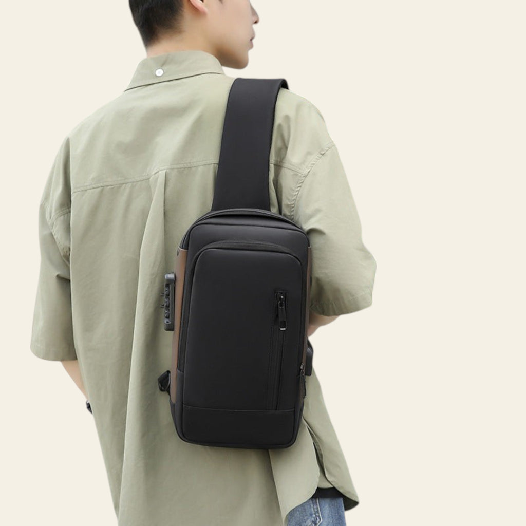 Person wearing a black crossbody bag in an urban setting