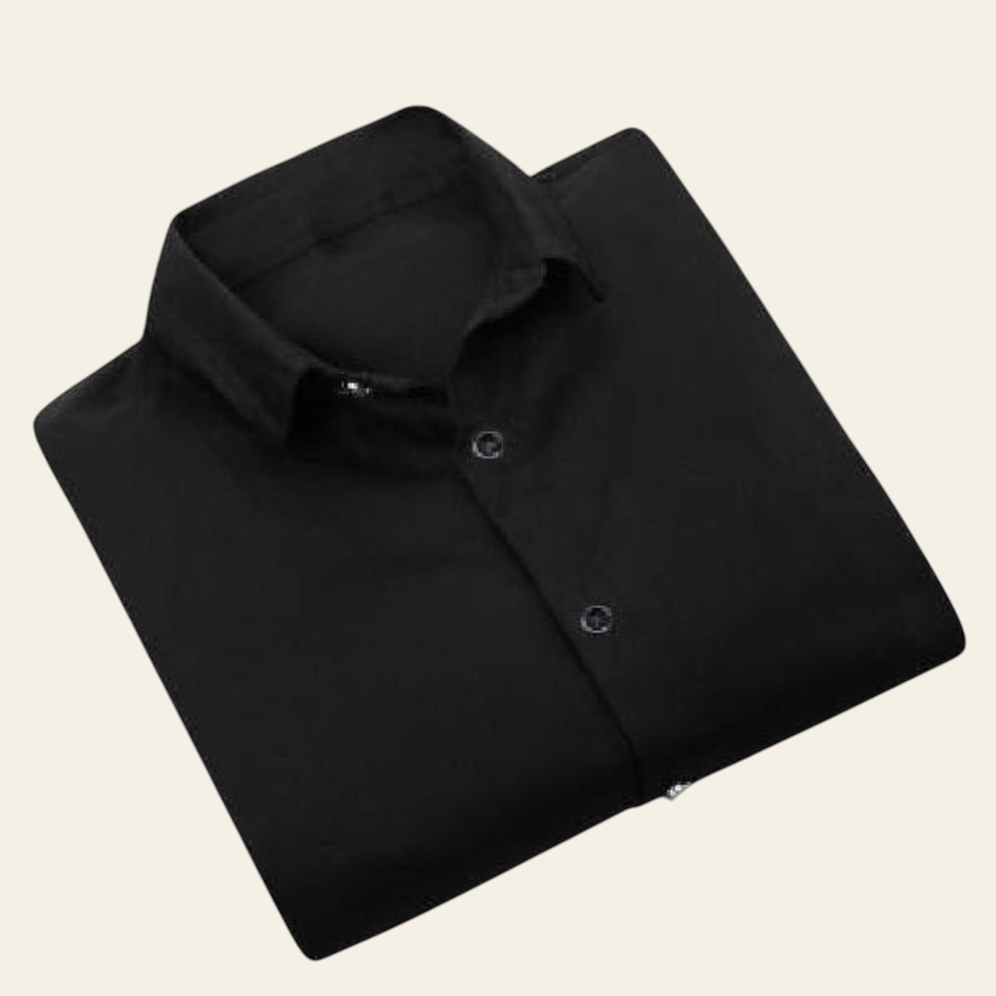Folded black shirt on a white background