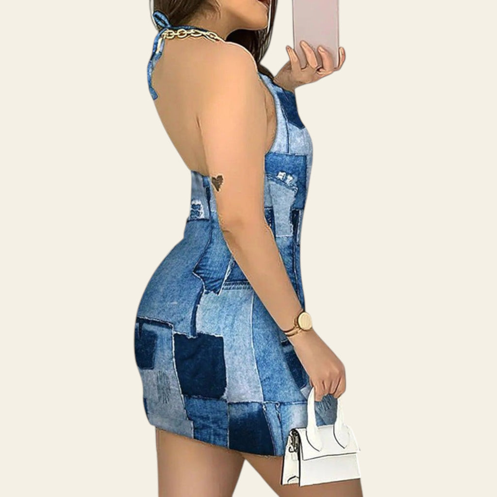 Side view of blue patchwork denim halterneck mini dress