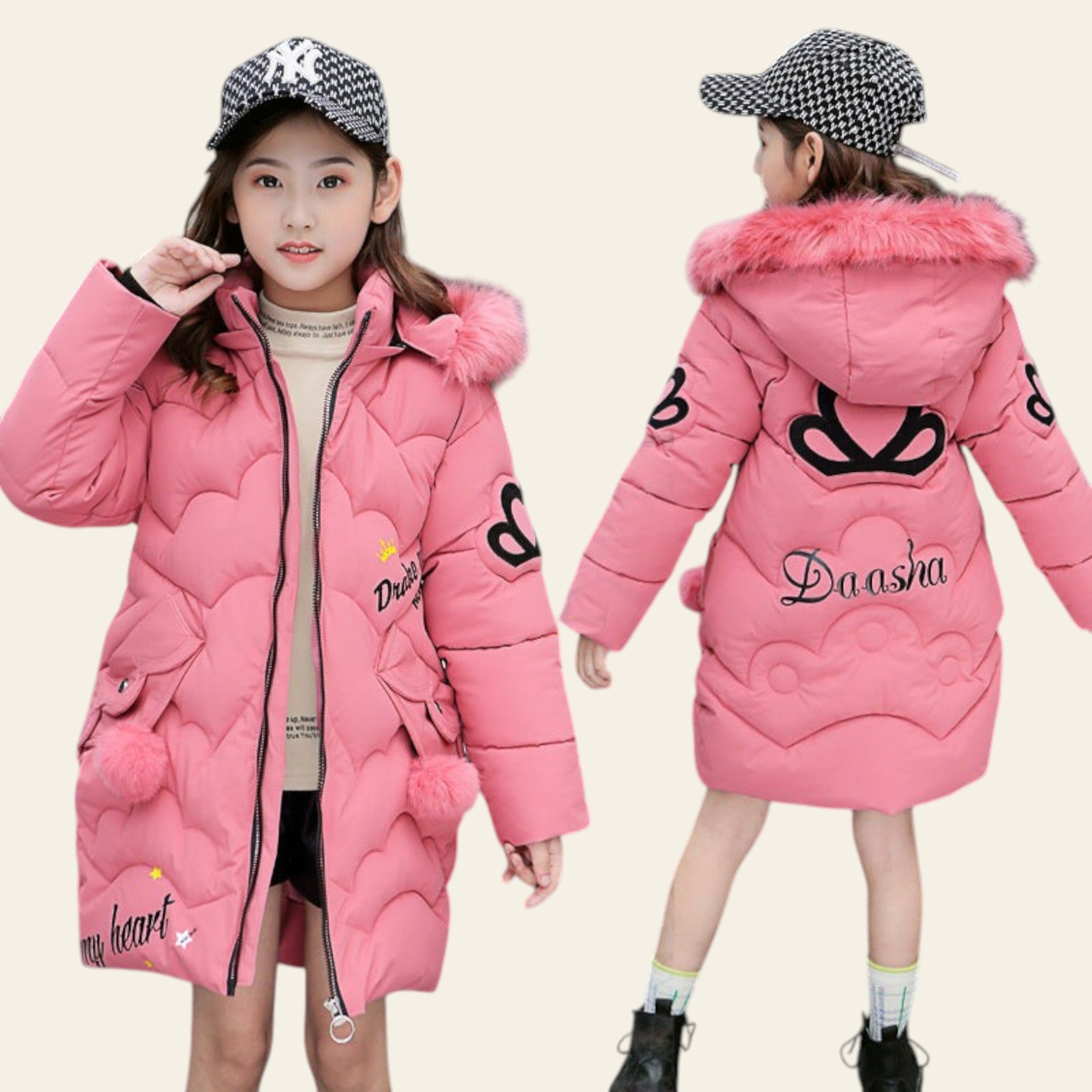 Two children wearing pink winter coats with fur-lined hoods in an urban setting.