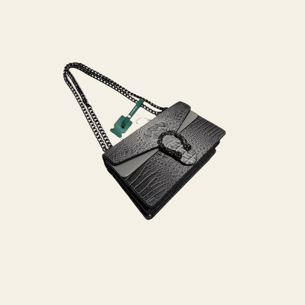 Black textured handbag with chain strap on a white surface with 'HURBENLUU' branding.