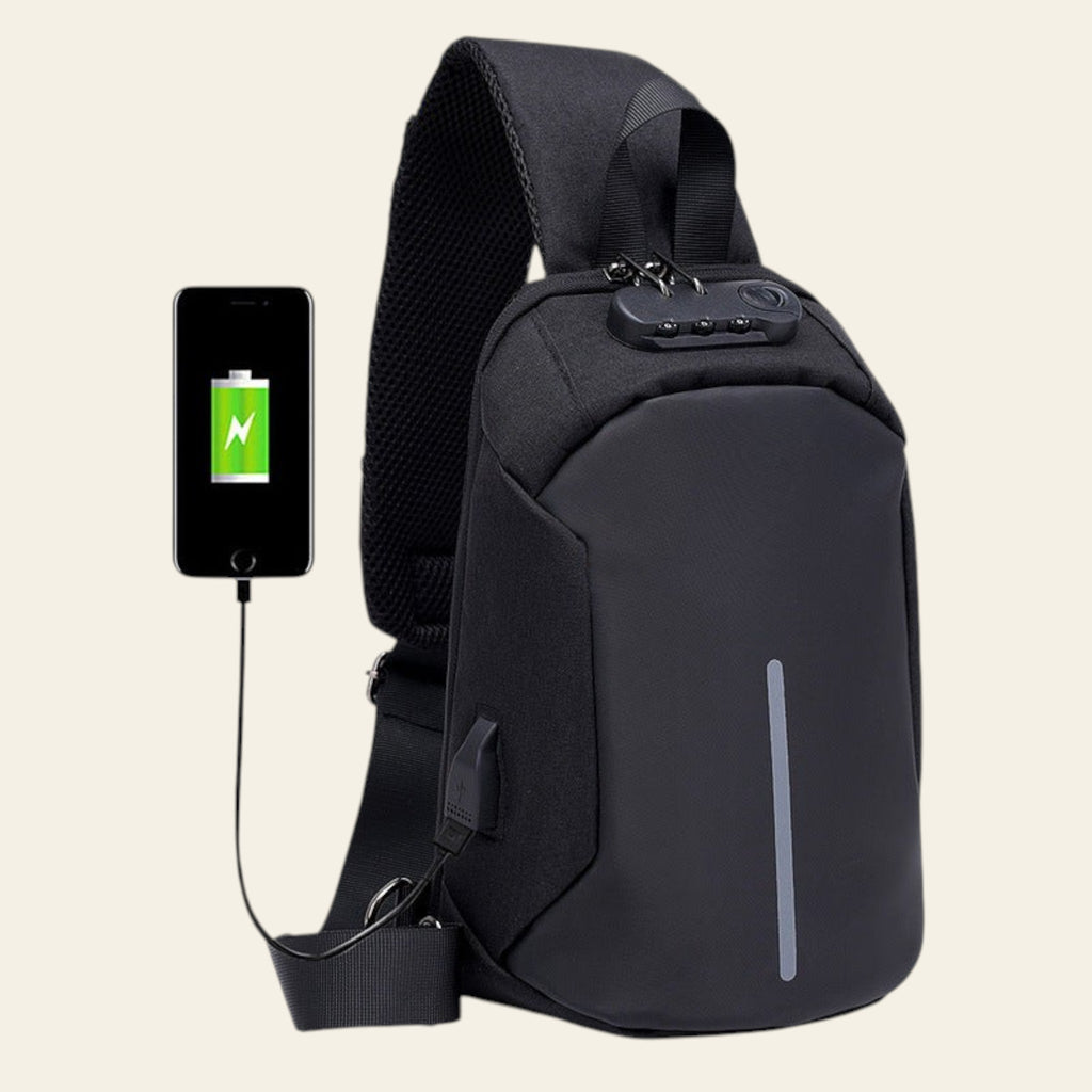 Black sling bag with USB port and smartphone charging on a white background