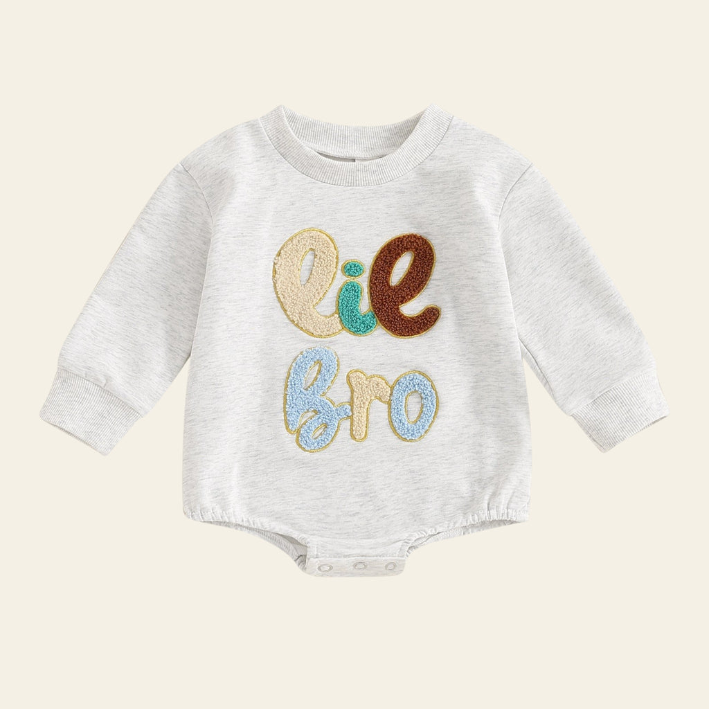 Baby onesie with 'Elle Bro' text on a white background