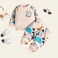Children's outfit with patterned shirt and shorts on a beige background