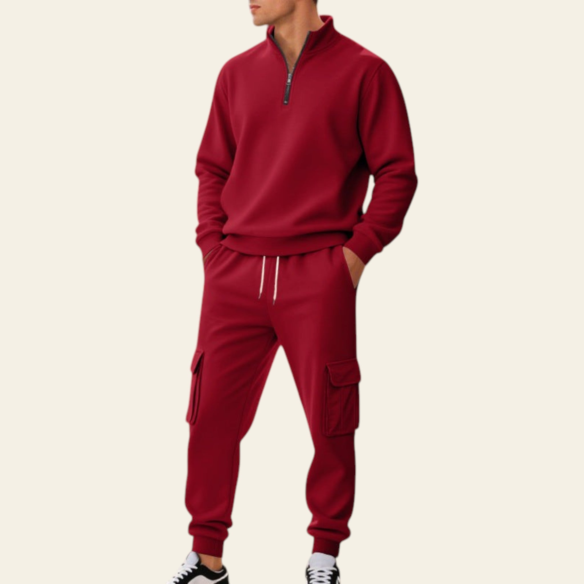 Man wearing a red fleece-lined tracksuit set with zip-up jacket and jogger pants on a city