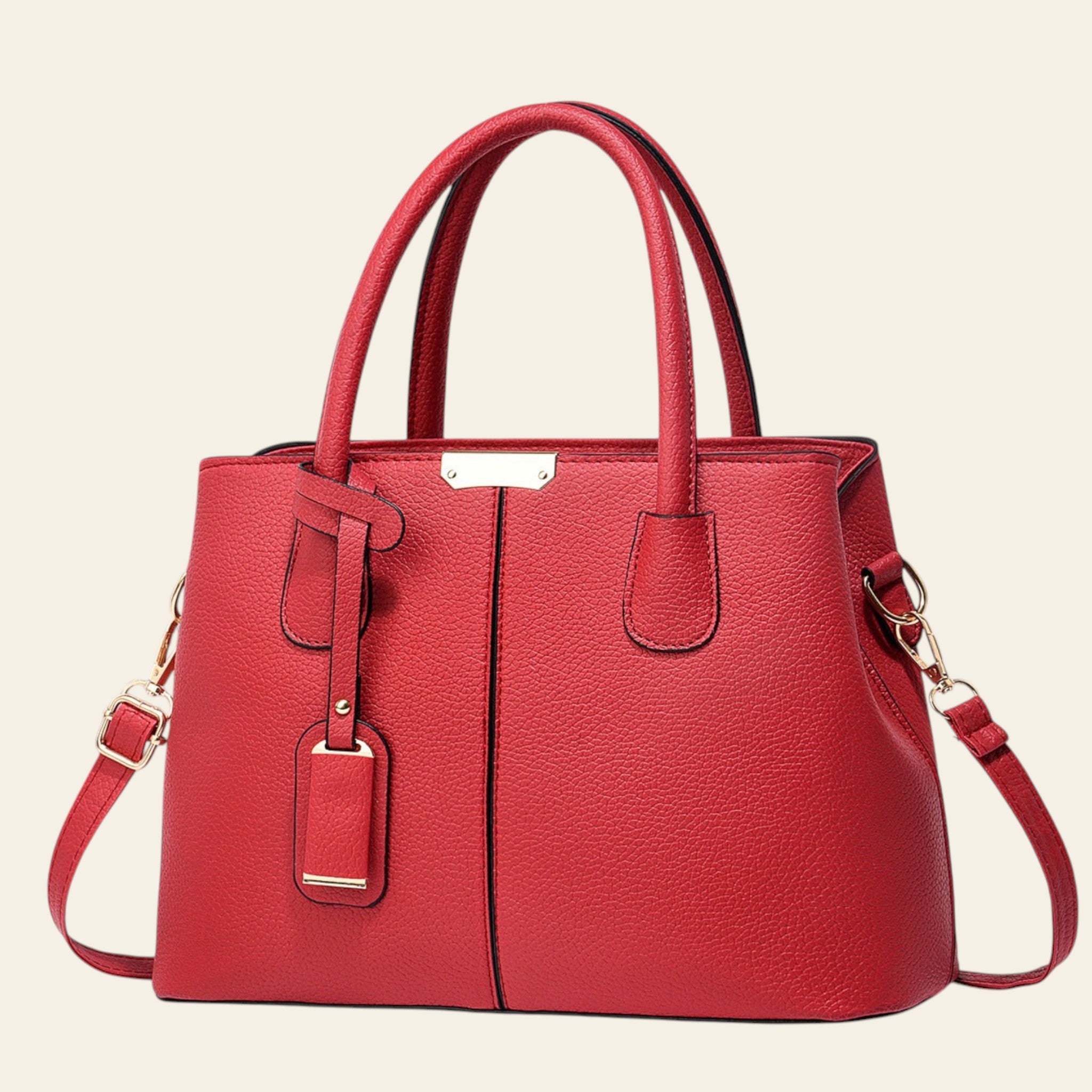 Red handbag with gold accents on a white background
