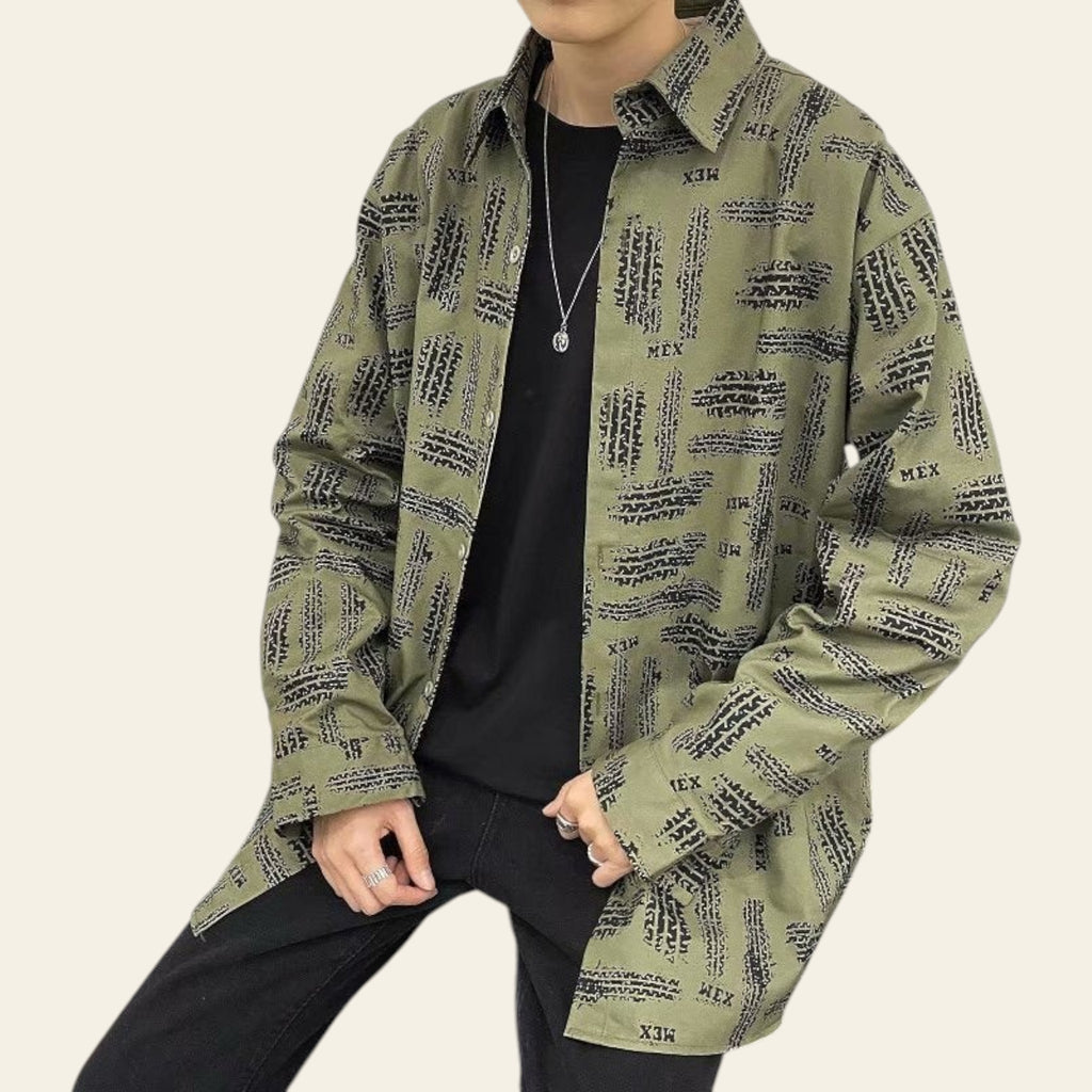 Front view of a green patterned zip-up hoodie jacket on a model