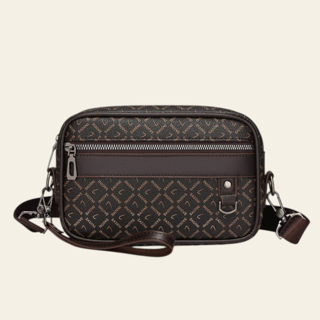 Brown patterned crossbody bag on a white background