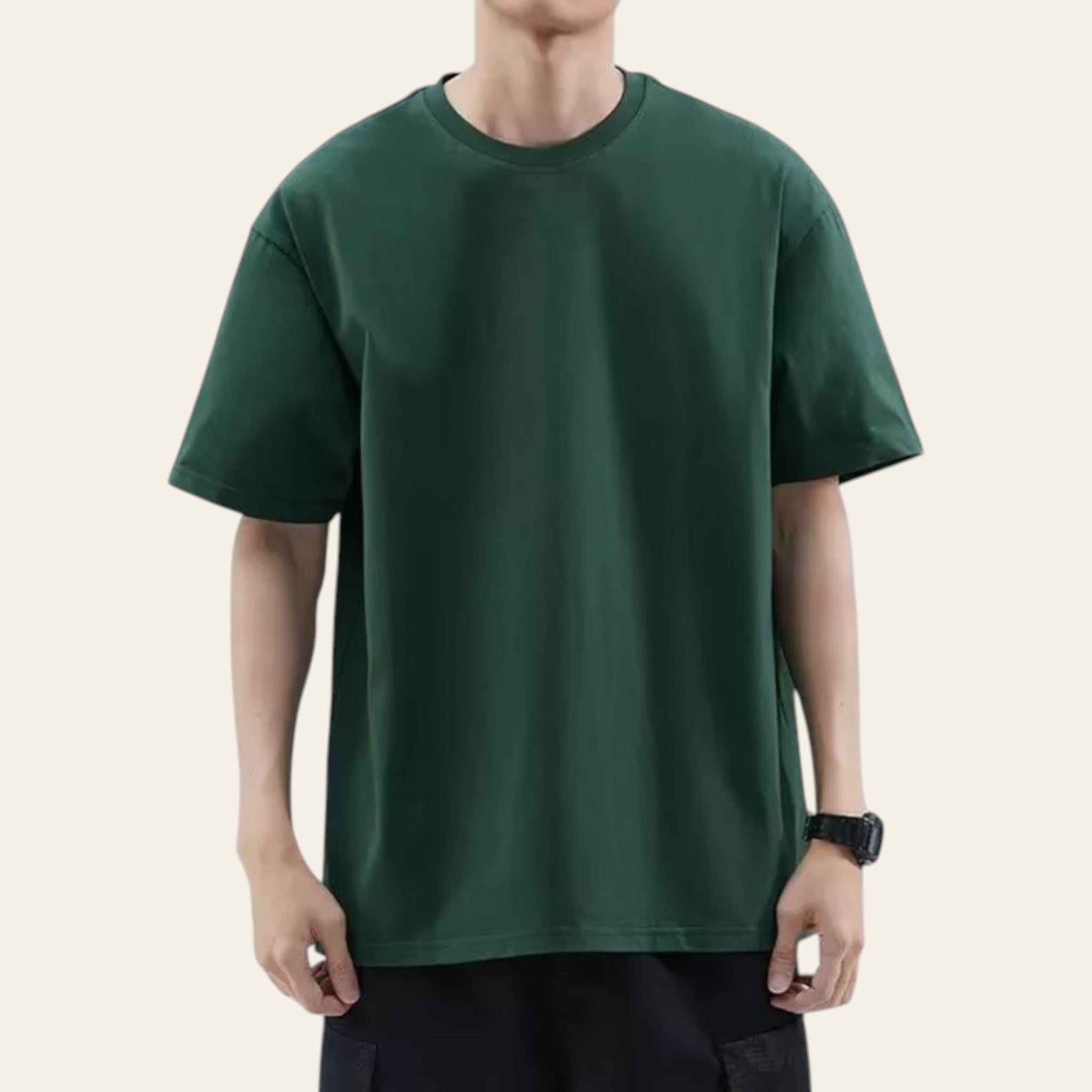Man wearing a green loose fit solid color t-shirt