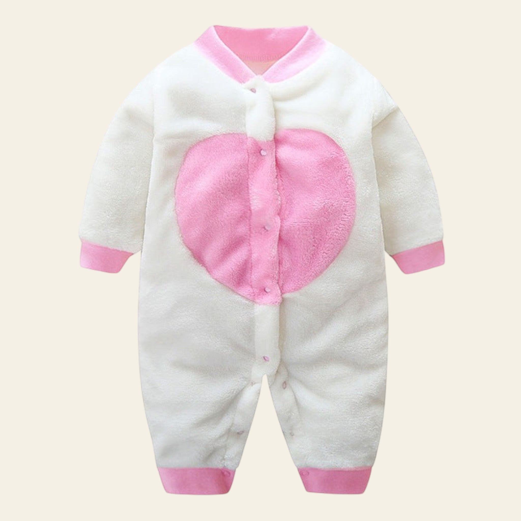 White baby onesie with pink heart design on a white background