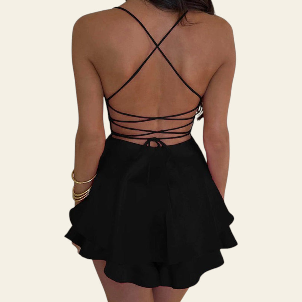 Black strappy top and skirt set on a neutral background