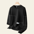 Black crewneck pullover sweatshirt on a hanger against a gray background