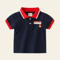 Navy blue polo shirt with red accents on a light gray background