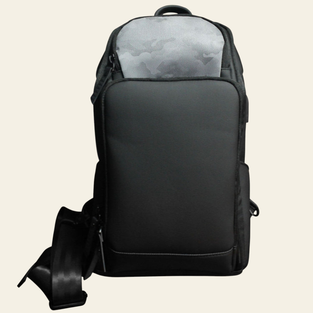 Black backpack with a gray interior on a white background