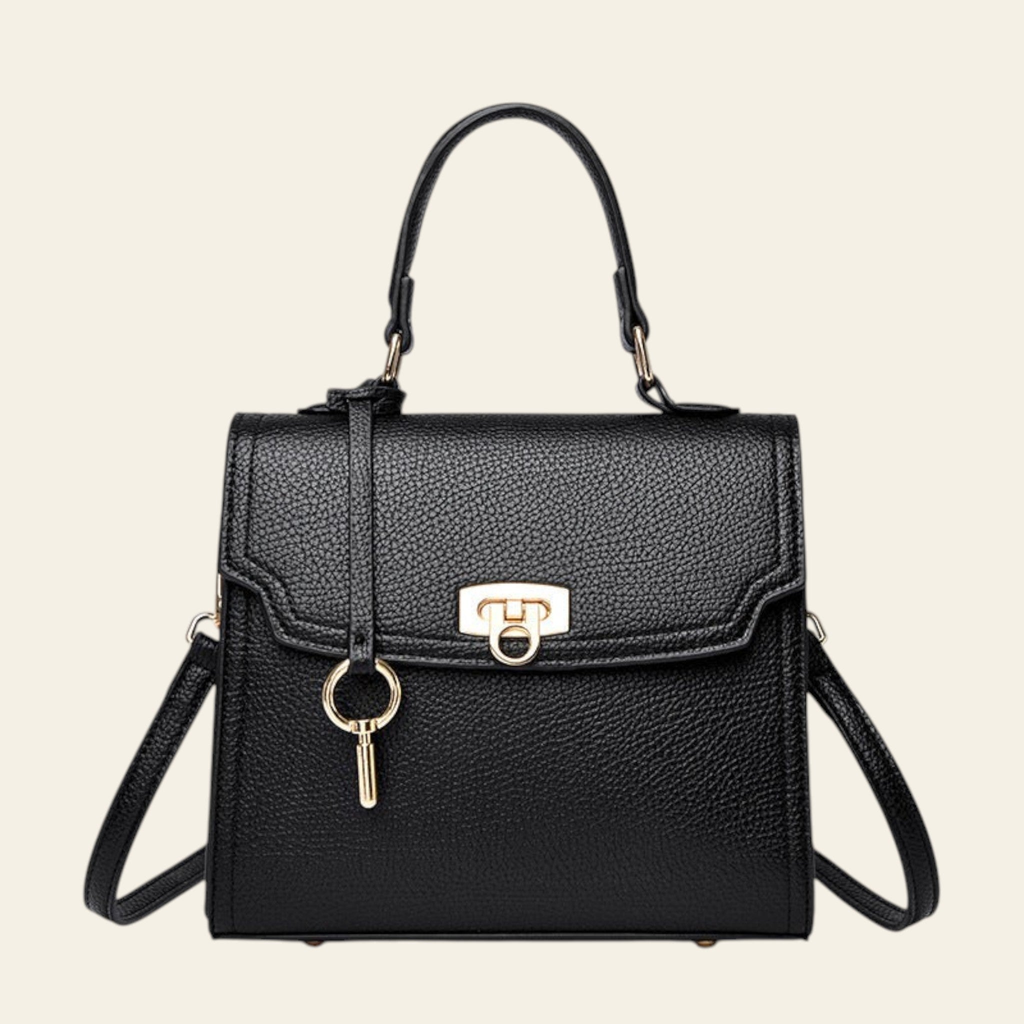 Black handbag with gold accents on a white background