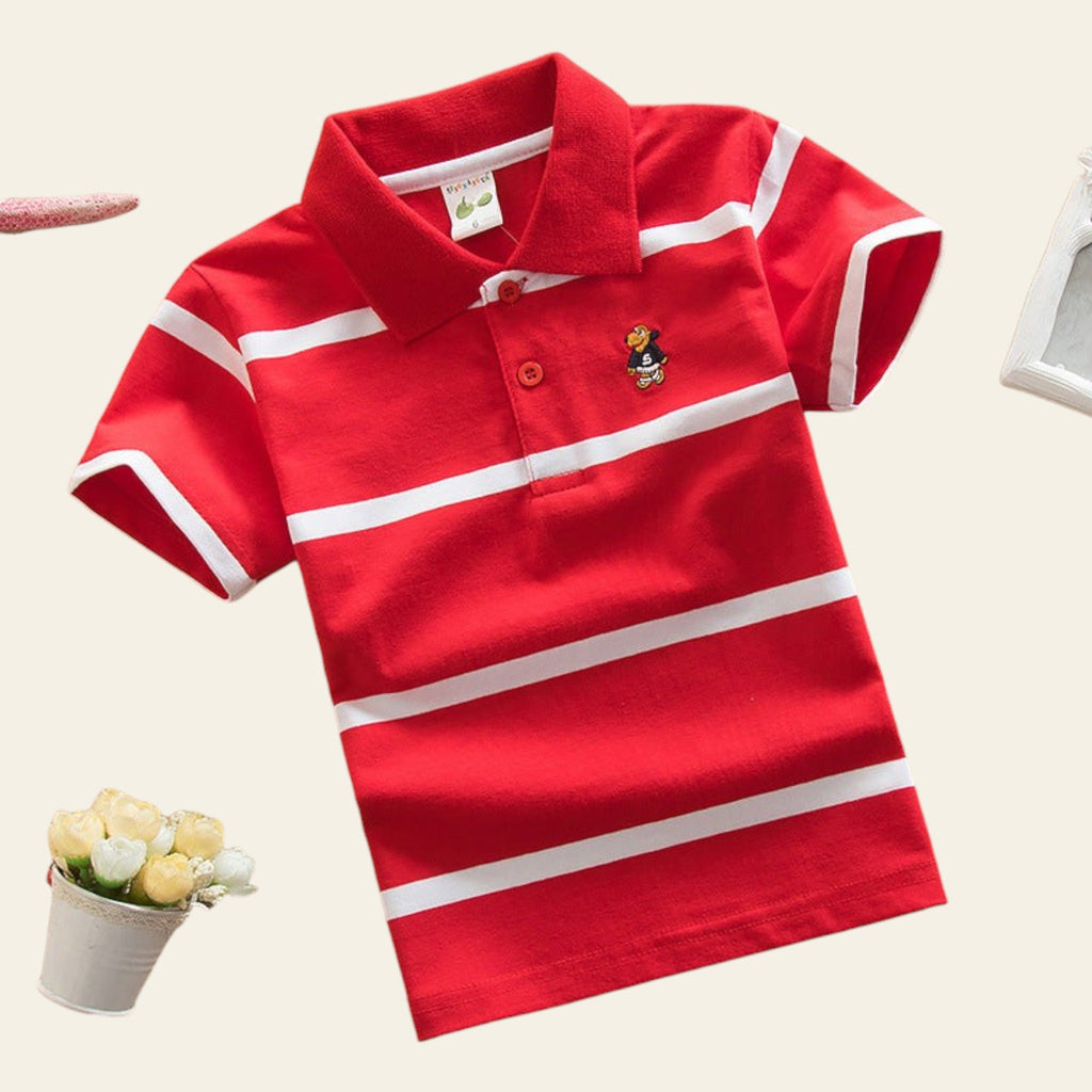 Red polo shirt with white stripes on a beige surface