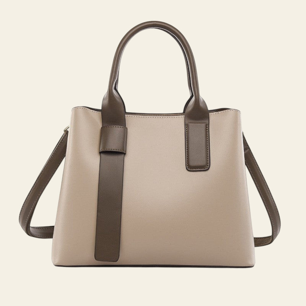Beige handbag with brown accents on a white background