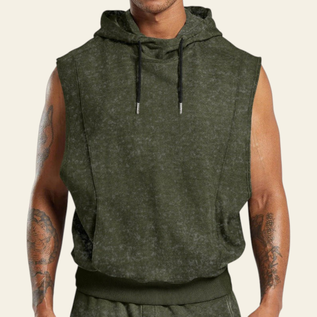 Man wearing a green sleeveless hoodie on a white background