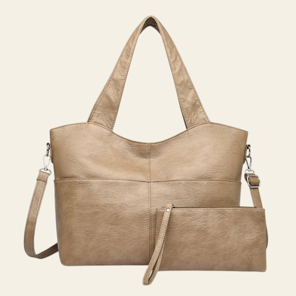 Beige handbag with a shoulder strap on a white background