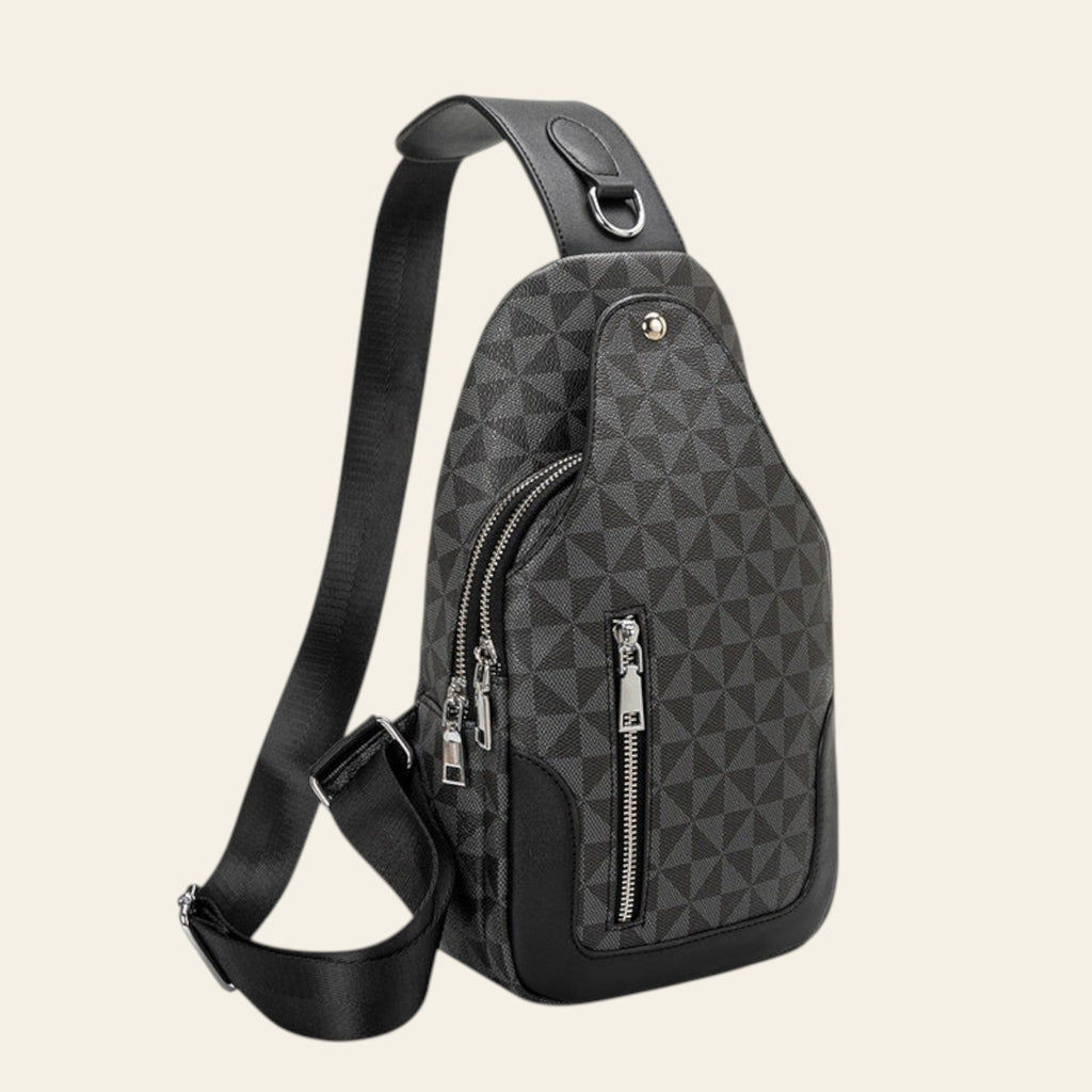 Gray geometric patterned sling bag with black accents on a white background