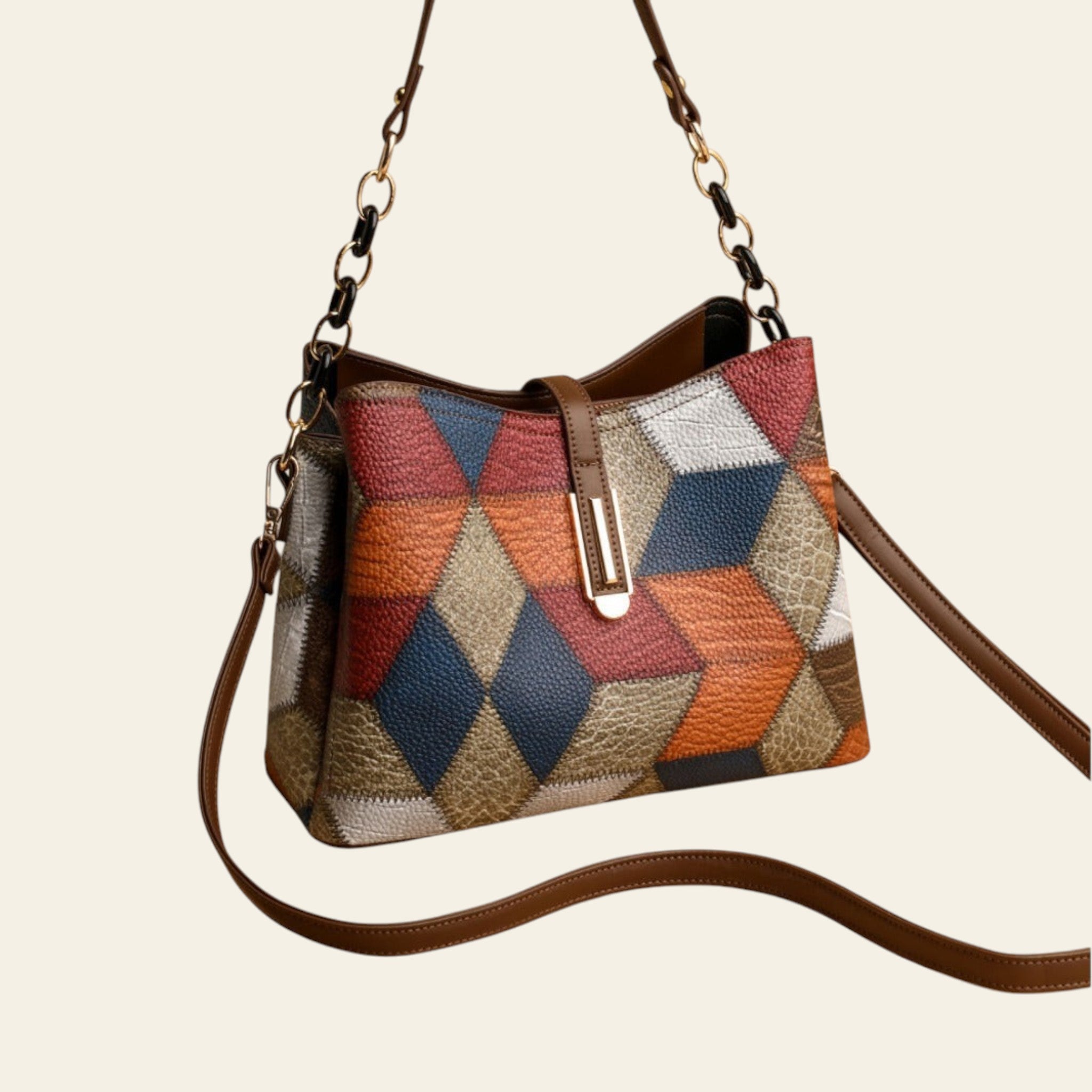 Multicolored patchwork handbag with brown strap on a beige background