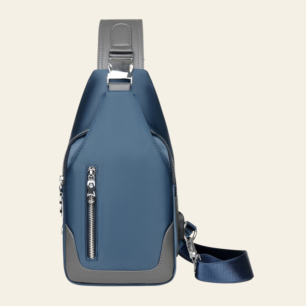 Blue and gray sling bag with zippers on a white background