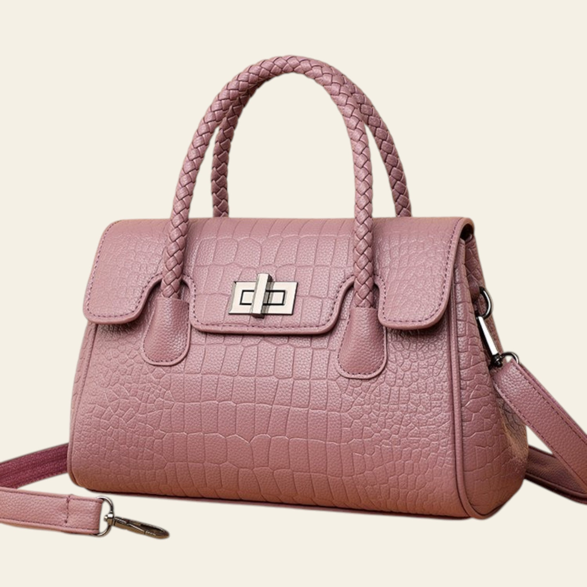Pink handbag with a textured pattern on a beige background