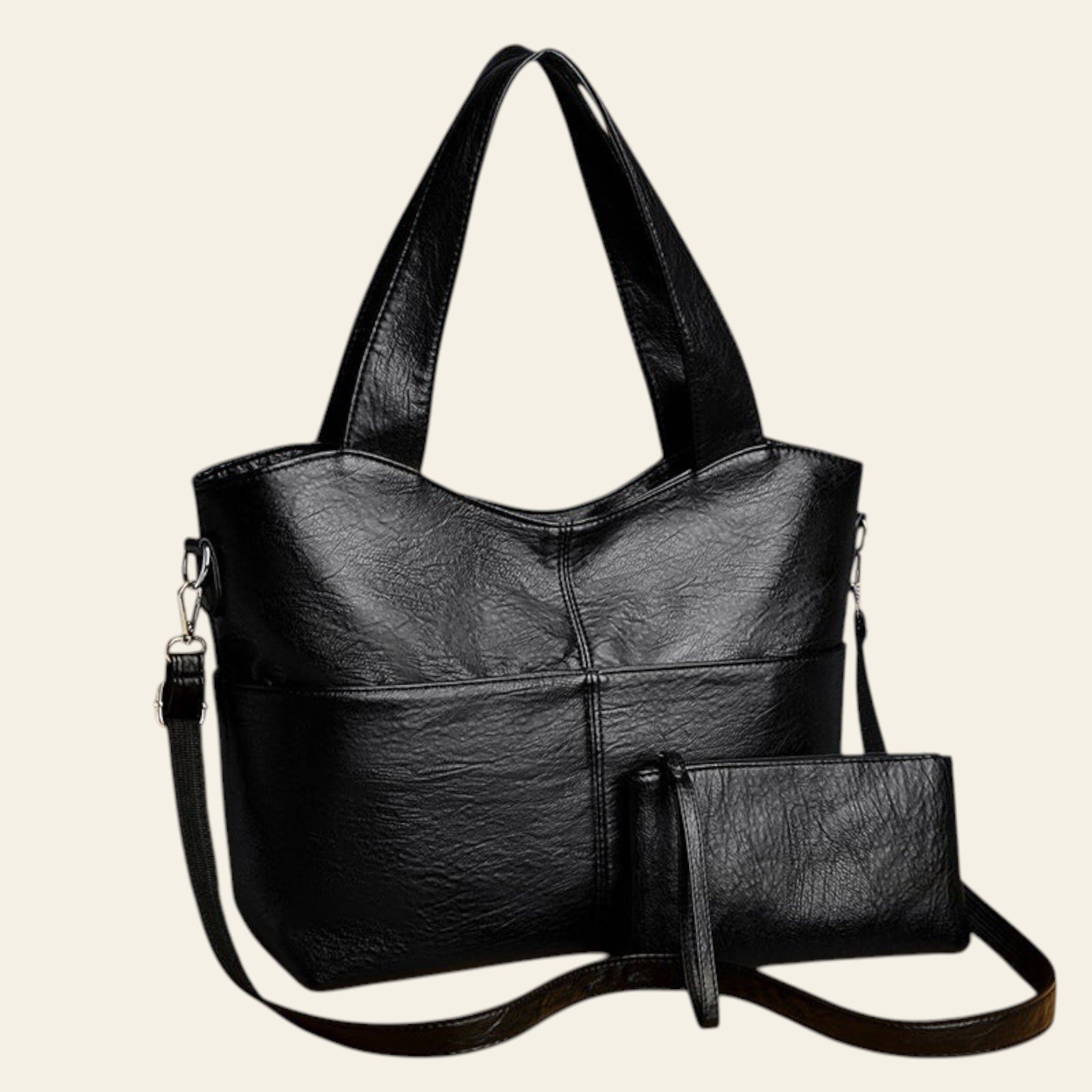 Black handbag with a matching pouch on a beige background