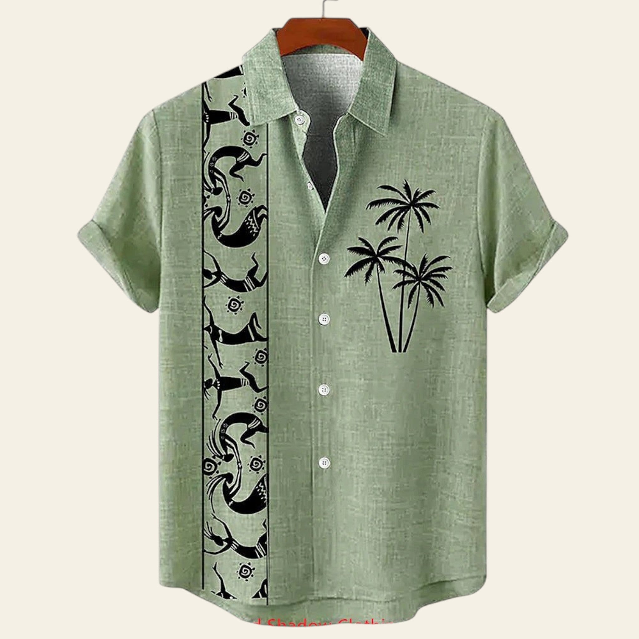 Green shirt with black palm tree design on a hanger against a white background