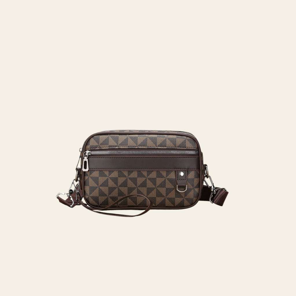 Brown patterned crossbody bag with measurements on a wooden surface