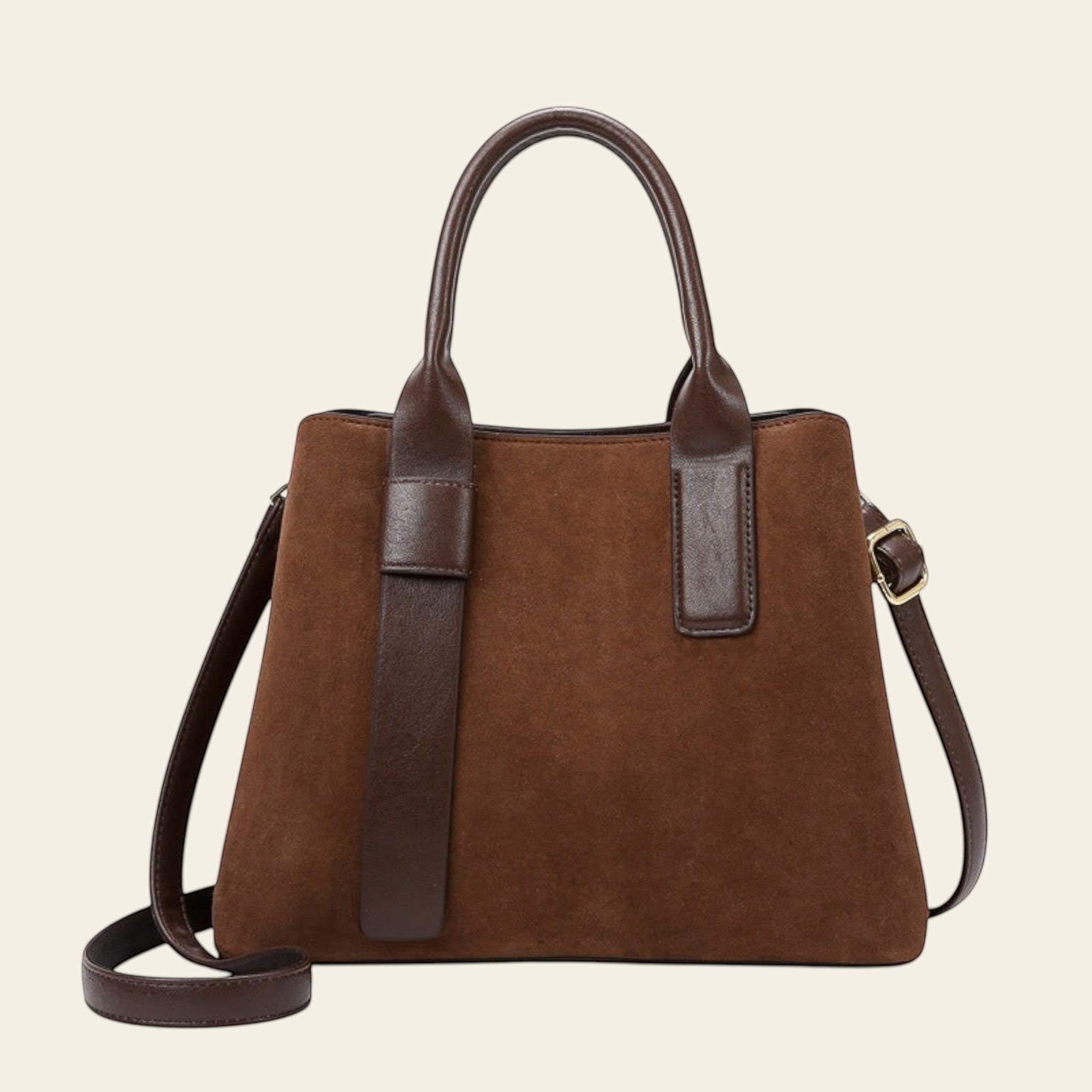Brown handbag with leather straps on a white background