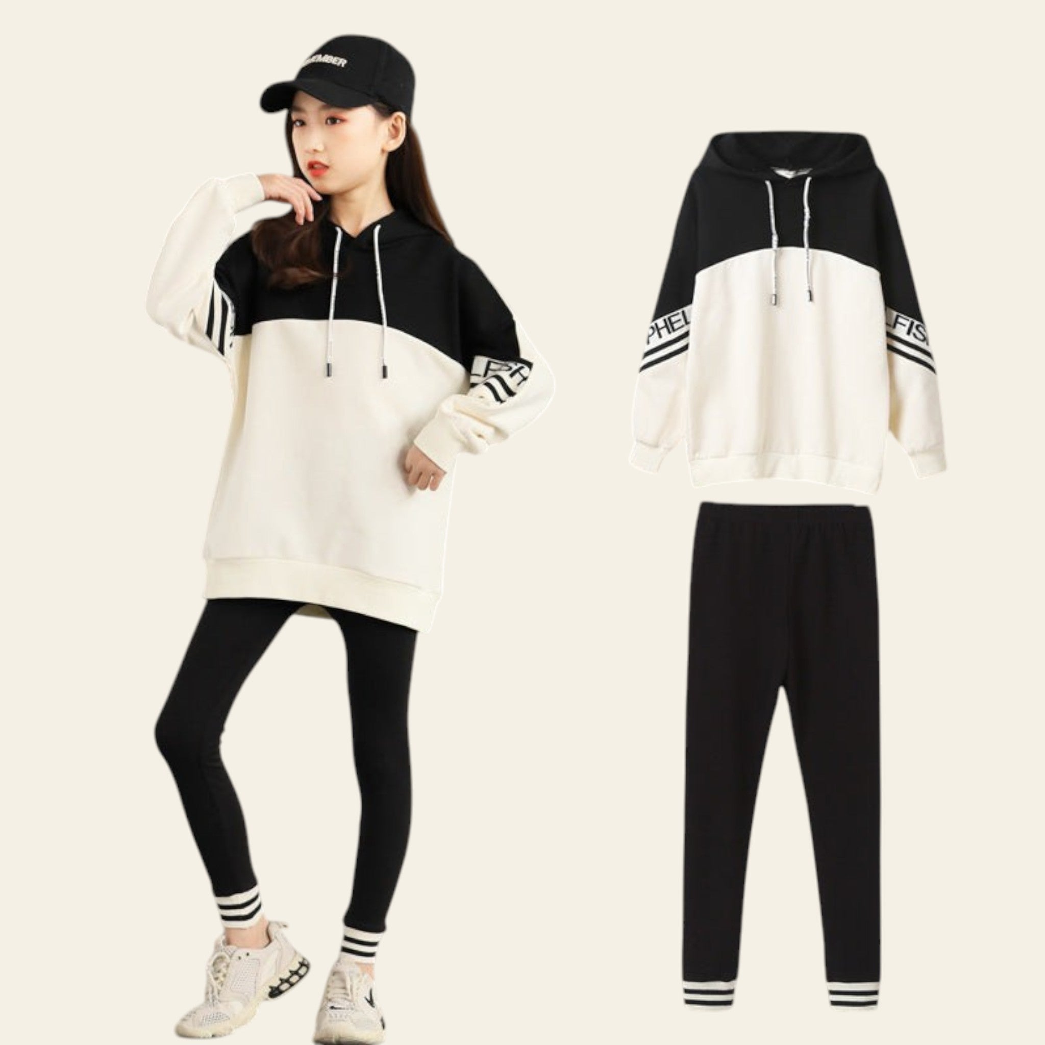 Black and white hoodie with matching pants on a gray background
