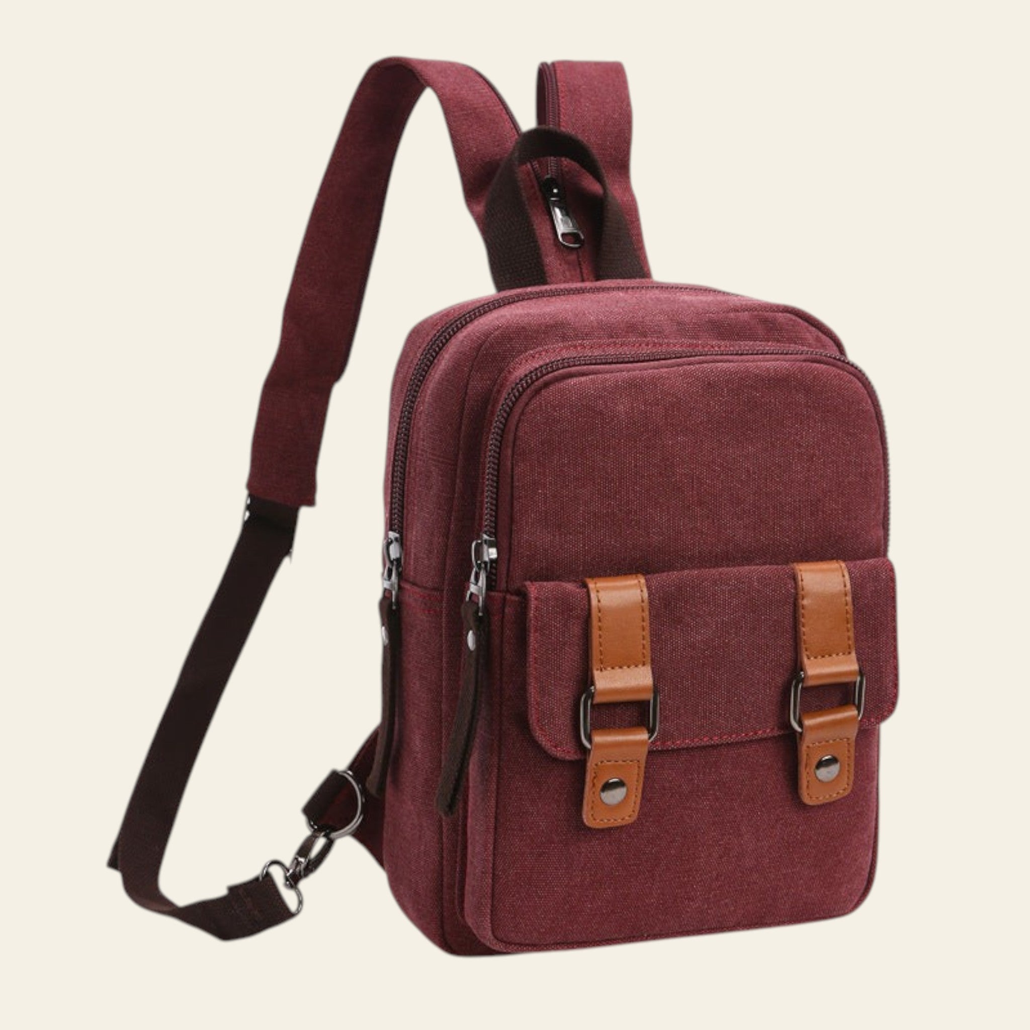 Maroon backpack with brown straps and accents on a white background