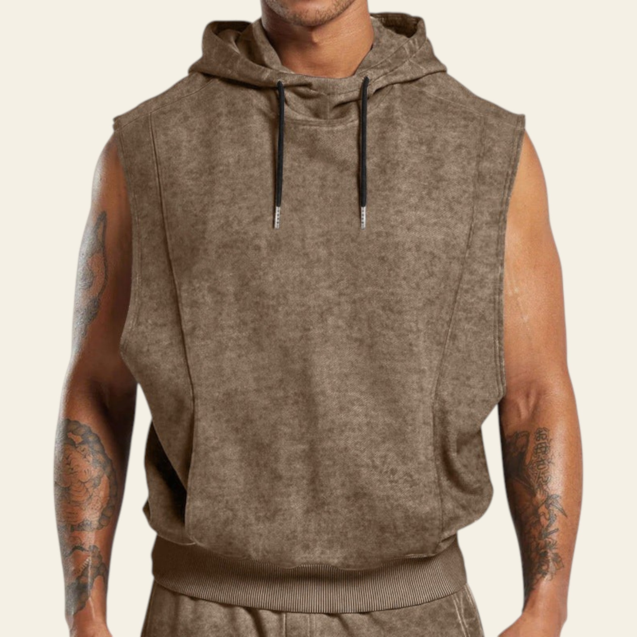 Man wearing a khaki sleeveless hoodie on a white background