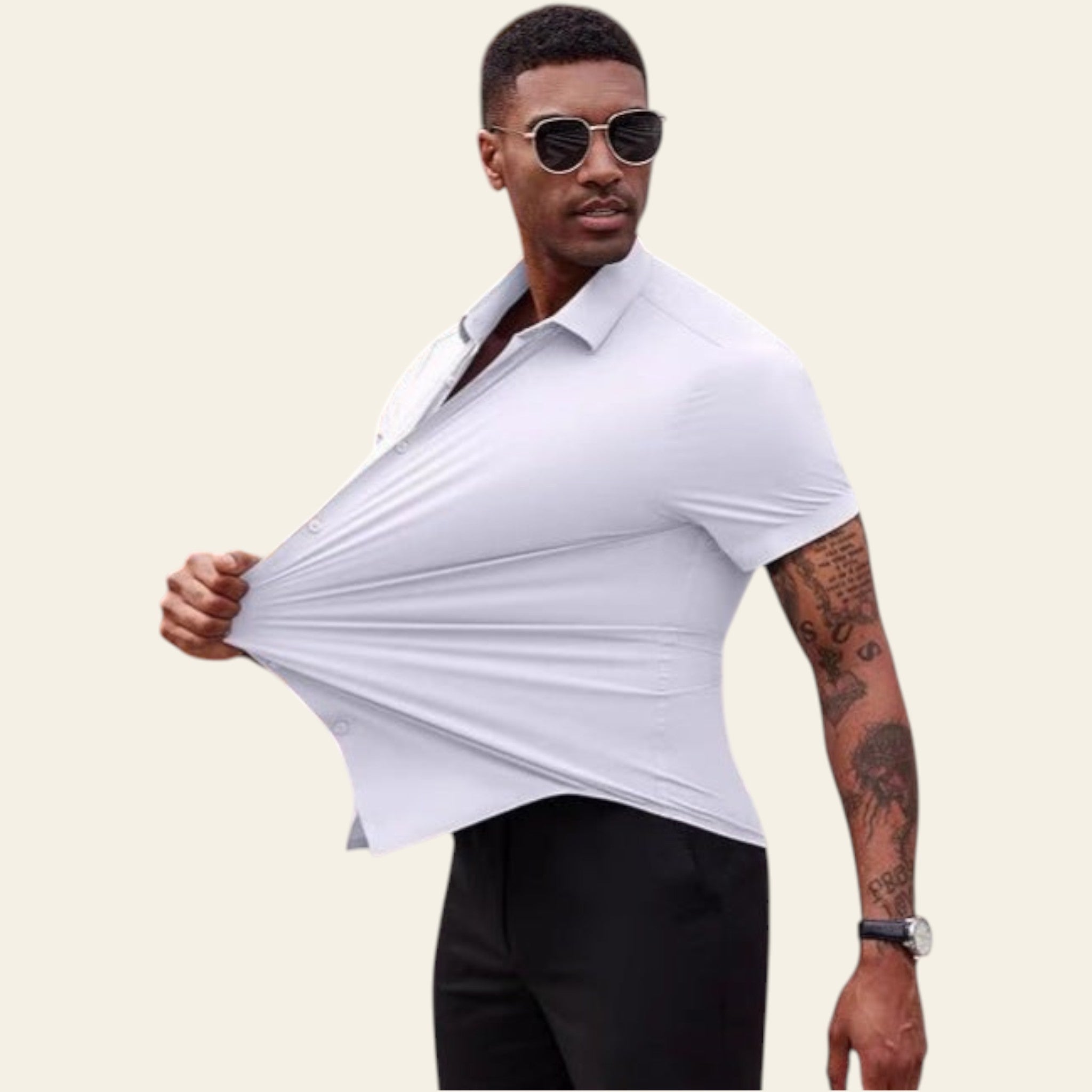 Man wearing a white shirt and sunglasses, standing on a street.