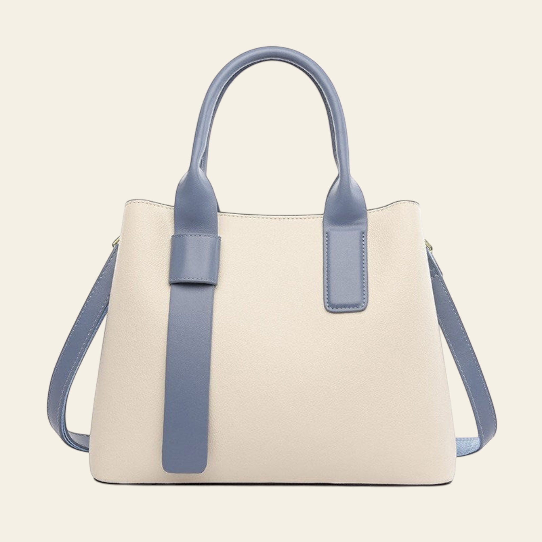 Beige handbag with blue handles and trim on a white background