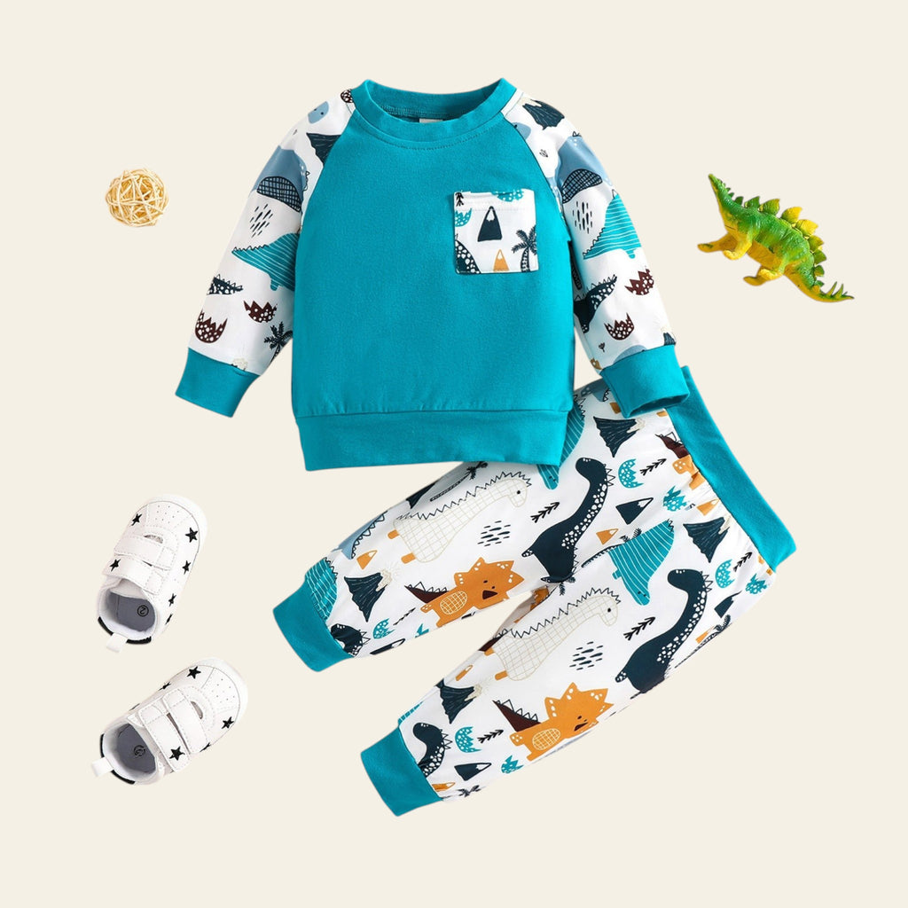 Children's pajama set with dinosaur pattern on a beige background